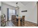 Dining room with modern light fixture, wood table set with seating for four at 446 Rycola Circle, Surfside Beach, SC 29575