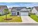 Charming single-story home with well-manicured lawn, two-car garage and lovely curb appeal at 446 Rycola Circle, Surfside Beach, SC 29575