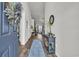 Inviting foyer featuring wood floors, console table and blue accent rug at 446 Rycola Circle, Surfside Beach, SC 29575