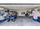 Spacious garage with golf cart, bicycle, and ample storage space, providing convenience and organization at 446 Rycola Circle, Surfside Beach, SC 29575