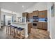Modern kitchen island with stainless steel appliances and barstool seating at 446 Rycola Circle, Surfside Beach, SC 29575