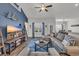 Comfortable living room featuring a sectional sofa, media center, and hardwood floors at 446 Rycola Circle, Surfside Beach, SC 29575