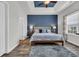 Comfortable primary bedroom with a tray ceiling, ensuite bath, and natural light at 446 Rycola Circle, Surfside Beach, SC 29575