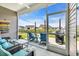 Outdoor screened-in porch with comfortable seating, string lights, and scenic views at 446 Rycola Circle, Surfside Beach, SC 29575