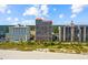 Beautiful aerial view of beachfront condos, sandy beach, and lush landscaping at 5308 N Ocean Blvd. # 1202, Myrtle Beach, SC 29577