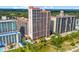 Expansive aerial view showcasing condo complex, outdoor pools, and lush green landscape at 5308 N Ocean Blvd. # 1202, Myrtle Beach, SC 29577