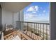 Balcony view of the beach with seating and a glimpse of the ocean at 5308 N Ocean Blvd. # 1202, Myrtle Beach, SC 29577
