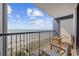 Balcony view of the beach with seating and blue skies in the background at 5308 N Ocean Blvd. # 1202, Myrtle Beach, SC 29577