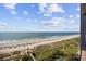 Expansive beach view showcasing the sandy shoreline, ocean, and blue sky at 5308 N Ocean Blvd. # 1202, Myrtle Beach, SC 29577