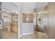 Hallway leading to bathroom showcasing decorative wall art and neutral color palette at 5308 N Ocean Blvd. # 1202, Myrtle Beach, SC 29577