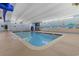 Relaxing indoor pool area with beach mural creating a serene environment at 5308 N Ocean Blvd. # 1202, Myrtle Beach, SC 29577