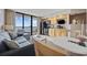 Bright living area with ocean views from balcony, combined with an efficiently equipped kitchenette, creating a cozy and modern space at 5308 N Ocean Blvd. # 1202, Myrtle Beach, SC 29577