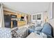 Inviting living room and kitchenette, designed with relaxing blue hues and featuring modern appliances for a comfortable stay at 5308 N Ocean Blvd. # 1202, Myrtle Beach, SC 29577