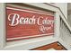 Close up of the 'Beach Colony Resort' sign, showcasing the branding and welcoming atmosphere of this coastal getaway at 5308 N Ocean Blvd. # 1202, Myrtle Beach, SC 29577
