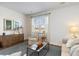 Inviting living room featuring a large window, comfortable seating, and stylish decor, perfect for relaxing and entertaining at 556 Strawberry Field Way, Galivants Ferry, SC 29544