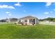 A well-maintained backyard with a lush lawn and patio area, perfect for outdoor enjoyment and relaxation at 568 Mossbank Loop, Longs, SC 29568