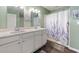 Well-lit bathroom featuring a double vanity with white countertops and a shower-tub combination at 568 Mossbank Loop, Longs, SC 29568