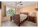 Bright bedroom with wood floors, natural light and a ceiling fan creates a comfortable living space at 568 Mossbank Loop, Longs, SC 29568