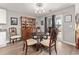 Charming dining room featuring a wooden table set, china cabinet, and sliding door to outdoor space at 568 Mossbank Loop, Longs, SC 29568