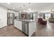 Bright kitchen with stainless steel appliances, granite countertops, and kitchen island at 568 Mossbank Loop, Longs, SC 29568