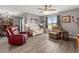 Cozy living room with hardwood floors, comfortable seating, and bright natural light at 568 Mossbank Loop, Longs, SC 29568