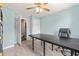 Home office with neutral walls, ceiling fan, sleek desk, and a modern rolling office chair at 568 Mossbank Loop, Longs, SC 29568
