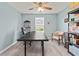 Bright home office with neutral walls, ceiling fan, sleek desk, and a combination of modern and traditional furnishings at 568 Mossbank Loop, Longs, SC 29568
