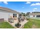 Spacious backyard patio with outdoor furniture and well-maintained lawn, perfect for outdoor gatherings at 568 Mossbank Loop, Longs, SC 29568