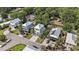 An aerial view of a charming neighborhood featuring multi-story homes with manicured lawns and lush landscaping at 58 Fathom Ln., Murrells Inlet, SC 29576