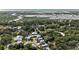An aerial view displays waterfront homes nestled amongst a lush maritime forest and expansive marsh views at 58 Fathom Ln., Murrells Inlet, SC 29576