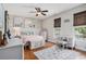 Serene bedroom with three arched mirrors above the bed, complemented by light-colored furniture and a large decorative rug at 58 Fathom Ln., Murrells Inlet, SC 29576