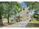 Charming coastal home featuring a lift, carport, and well-maintained landscaping with mature trees at 58 Fathom Ln., Murrells Inlet, SC 29576