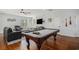 Entertaining space with pool table, comfortable seating, and seamless flow to other living areas at 58 Fathom Ln., Murrells Inlet, SC 29576