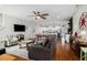 Open-concept living space with hardwood floors, modern furniture, pool table, and access to the kitchen at 58 Fathom Ln., Murrells Inlet, SC 29576