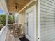 Inviting porch with rocking chairs, wood ceiling, and ceiling fan creating a relaxing outdoor space at 58 Fathom Ln., Murrells Inlet, SC 29576