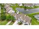 Aerial view of townhomes near a pond with fountain in a well-maintained community at 592 Riverward Dr. # 592, Myrtle Beach, SC 29588