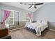 Cozy bedroom with two-tone walls, plush carpeting, and bright windows at 592 Riverward Dr. # 592, Myrtle Beach, SC 29588