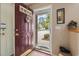 View through the front door highlighting the home's entryway and a glimpse of the neighborhood at 592 Riverward Dr. # 592, Myrtle Beach, SC 29588