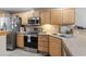 Kitchen features stainless steel appliances, wood cabinets, and ample countertop space at 592 Riverward Dr. # 592, Myrtle Beach, SC 29588