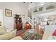 Bright, open living room featuring a vaulted ceiling, second floor balcony, and hardwood floors at 592 Riverward Dr. # 592, Myrtle Beach, SC 29588