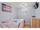 Cozy bedroom featuring nautical-themed decor, including a starfish-patterned bedspread and ocean-themed artwork at 6001-1623 S Kings Hwy., Myrtle Beach, SC 29575