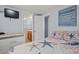 Bedroom with ocean themed decor, access to a bathroom with wood cabinets, and a door leading elsewhere at 6001-1623 S Kings Hwy., Myrtle Beach, SC 29575
