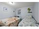Charming bedroom with two beds featuring unique bedding, and wall decor with a tropical theme at 6001-1623 S Kings Hwy., Myrtle Beach, SC 29575