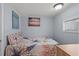Well-lit bedroom featuring comfortable bedding, and soothing beach-themed decor for a relaxing ambiance at 6001-1623 S Kings Hwy., Myrtle Beach, SC 29575