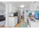 Efficient kitchen with white cabinets, appliances, and views to the living room and hallway at 6001-1623 S Kings Hwy., Myrtle Beach, SC 29575
