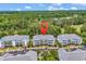 Aerial view of condo complex surrounded by lush green trees and golf course at 6015 Catalina Dr. # 733, North Myrtle Beach, SC 29582