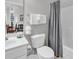 Bathroom offering a sink and toilet with towel racks next to a combined tub and shower at 6015 Catalina Dr. # 733, North Myrtle Beach, SC 29582