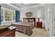 Inviting bedroom with tray ceiling, bright window, and a coordinated comforter set at 6015 Catalina Dr. # 733, North Myrtle Beach, SC 29582