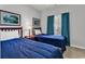 Bright bedroom featuring two twin beds, bedside table, and artwork creating a cozy and inviting atmosphere at 6015 Catalina Dr. # 733, North Myrtle Beach, SC 29582