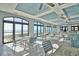 Bright and airy dining area with ocean views, tiled floors, and stylish tables and chairs at 6015 Catalina Dr. # 733, North Myrtle Beach, SC 29582